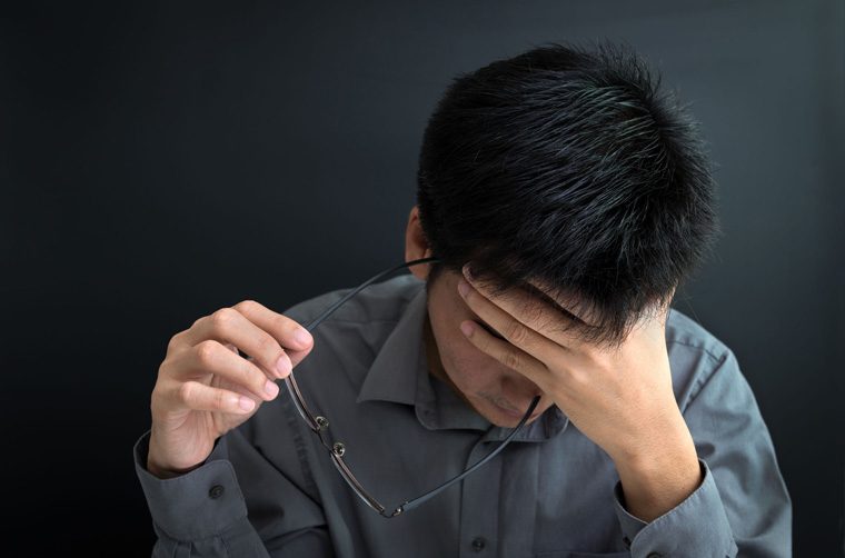 man holding forehead, wondering about generational curse