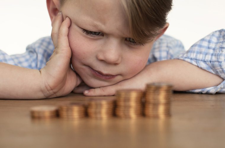 Child counting money - What do disciples of Jesus do with their money?