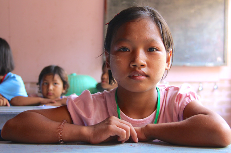 Picture of child at desk - Should you sponsor a child?