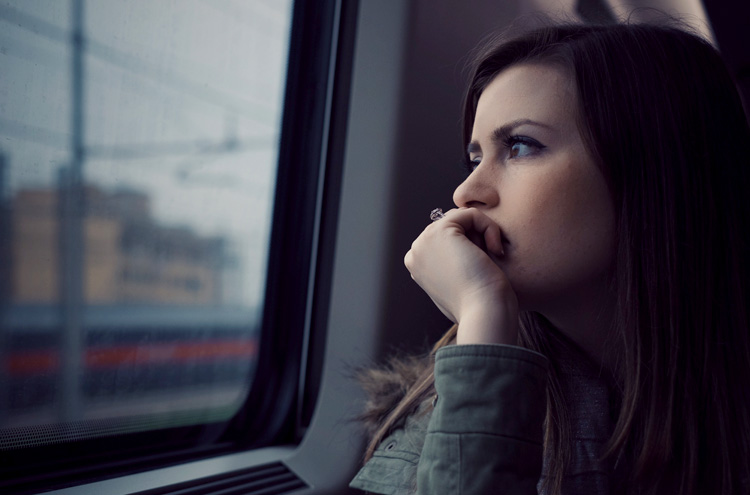 Woman looking out window - How do you find significance in your life?