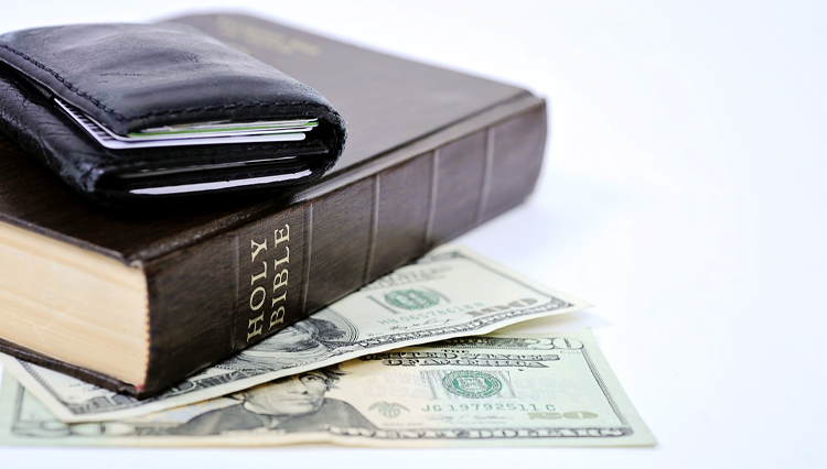 Wallet on Bible - Is it possible to be rich and righteous?