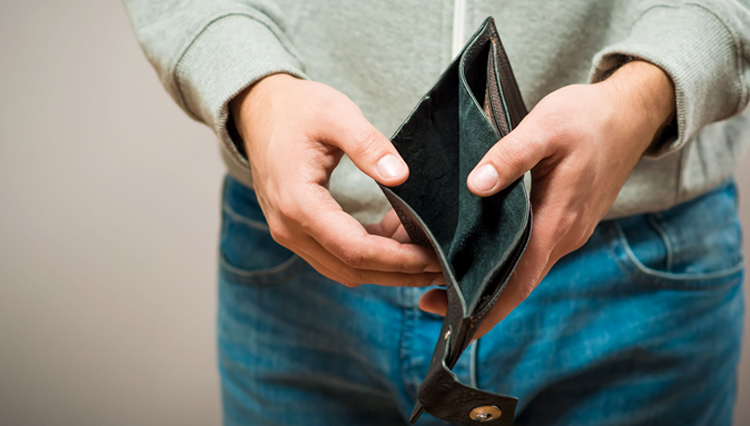 Man holding empty wallet - what does it mean to be poor in spirit?