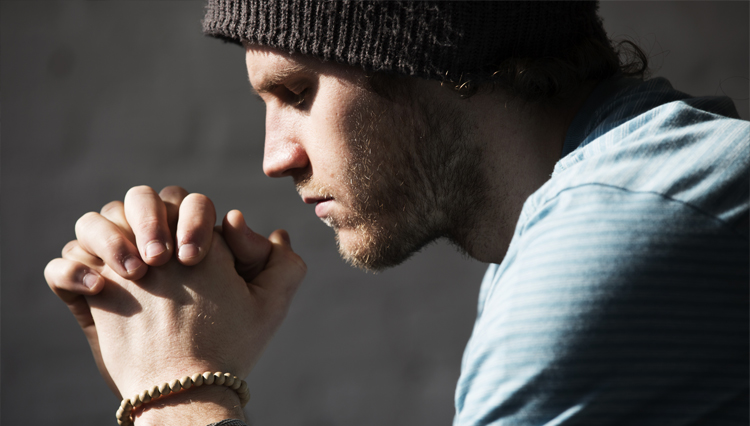 Picture of young man praying - what is the cure for lust?