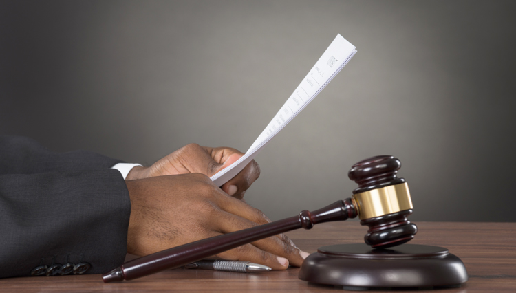 Picture of judge's hands next to gavel