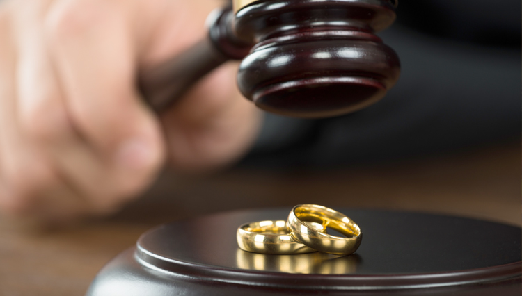 Picture of wedding rings and judge's gavel - symbolic of divorce