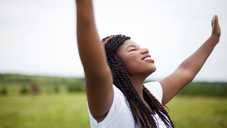 Woman lifting her hands in worship