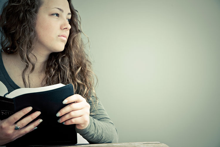 Young lady reading her Bible