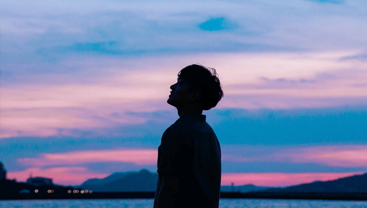 Man looking at sky, wondering why he was brought into existence