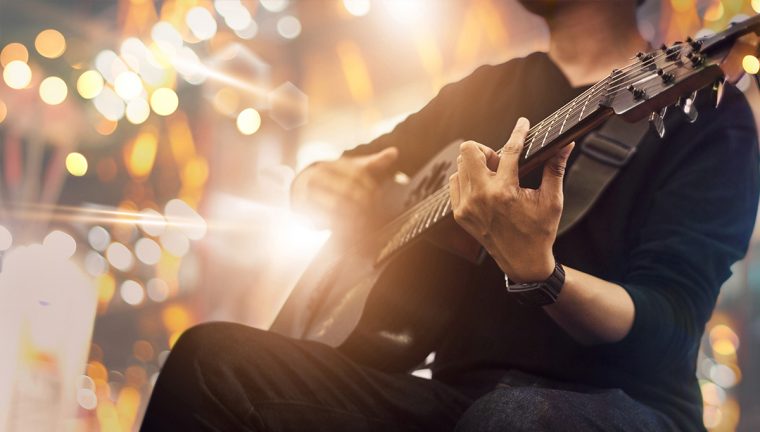 Picture of a man playing guitar